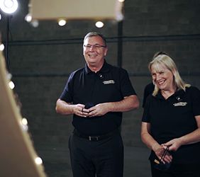 Steve and Christine Yorke-Robinson taking part in the surprise video when they finally took off their blindfolds to reveal a special 25th anniversary photo wall