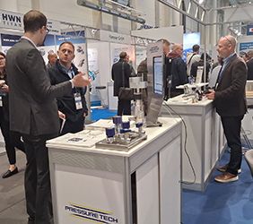 Various photos of Pressure Tech's exhibition stand at the Hydrogen Tech World Expo in Hamburg showcasing the new iPad game launched.
